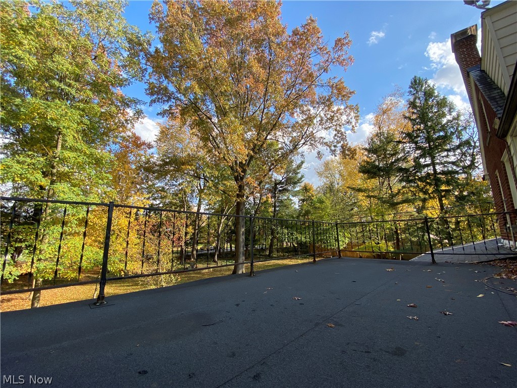 1387 Clearview Road Cleveland, OH 44124 - Photo 23 of 33 Large balcony located off of bedroom #3 is fenced all the way around and perfect for enjoying coffee while watching the deer in this beautiful yard.