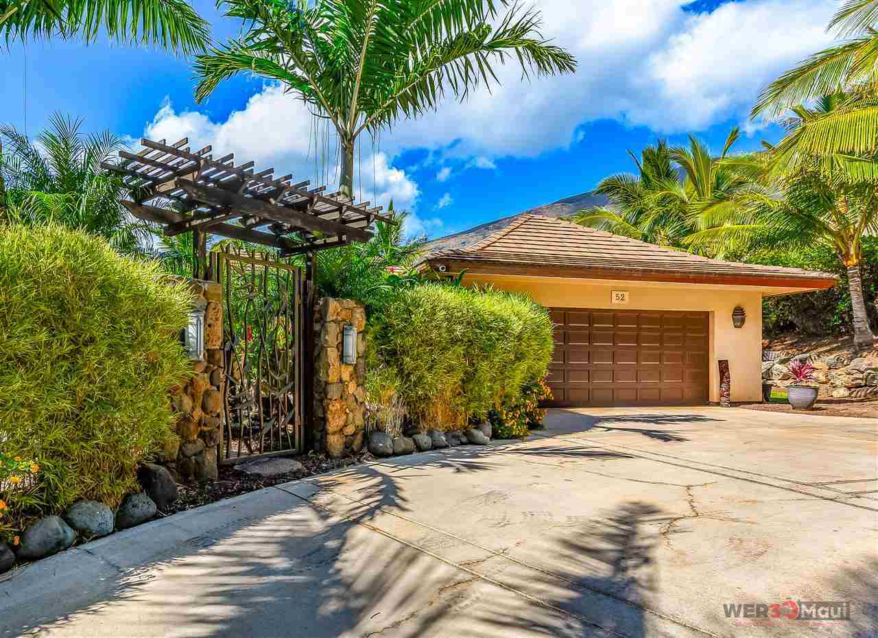 52 Lau Niu Way, Unit A Lahaina, HI 96761 - Photo 17 of 28 a front view of a house with a yard and garage