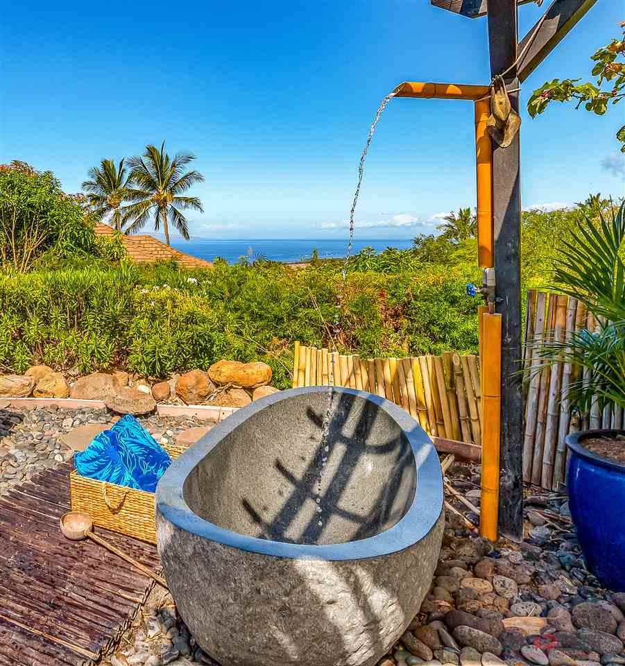 52 Lau Niu Way, Unit A Lahaina, HI 96761 - Photo 26 of 28 a view of a swimming pool with a lounge chair