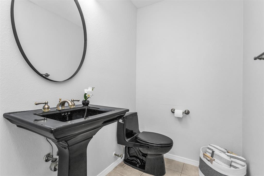 7233 Rustic Valley Drive Dallas, TX 75248 - Photo 14 of 21 a bathroom with a sink and a mirror