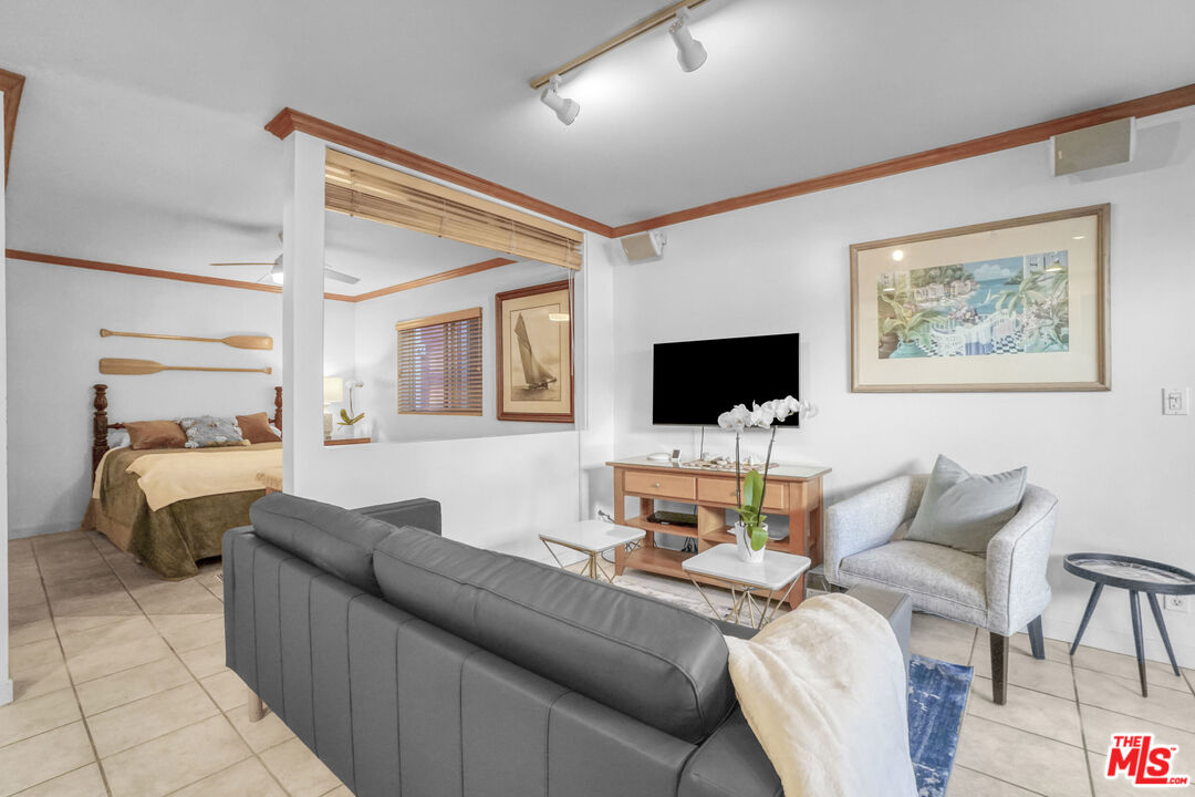 120 Fleet Street, Unit C Marina del Rey, CA 90292 - Photo 16 of 23 a living room with furniture and a flat screen tv