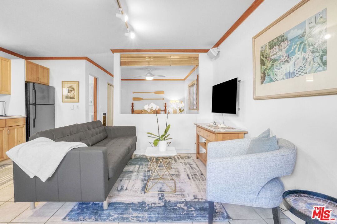 120 Fleet Street, Unit C Marina del Rey, CA 90292 - Photo 5 of 23 a living room with furniture and a flat screen tv
