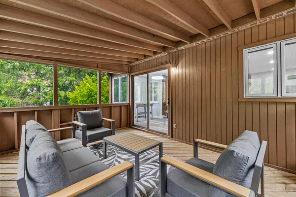 a view of a dining room with furniture window and outside view