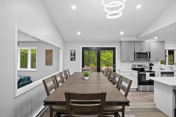 a view of an entryway with wooden floor and windows
