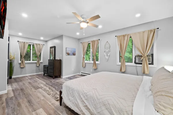 a bedroom with furniture and a baby crib