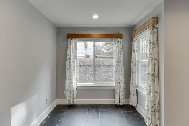 a view of room with window and hardwood floor