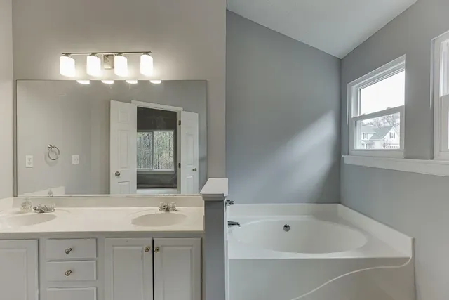 a bathroom with a toilet and a glass door