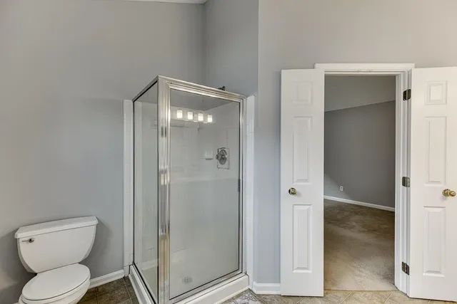 a backyard of a house with large trees