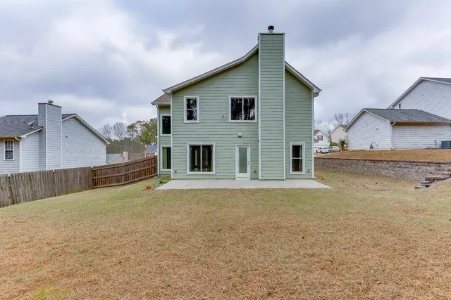 a house view with a backyard space
