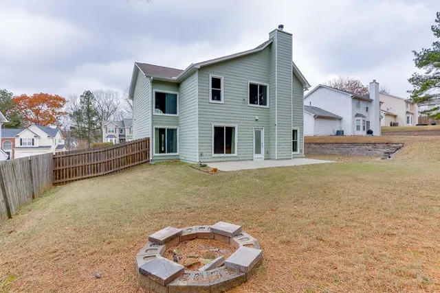 a backyard of a house with lots of green space and trees