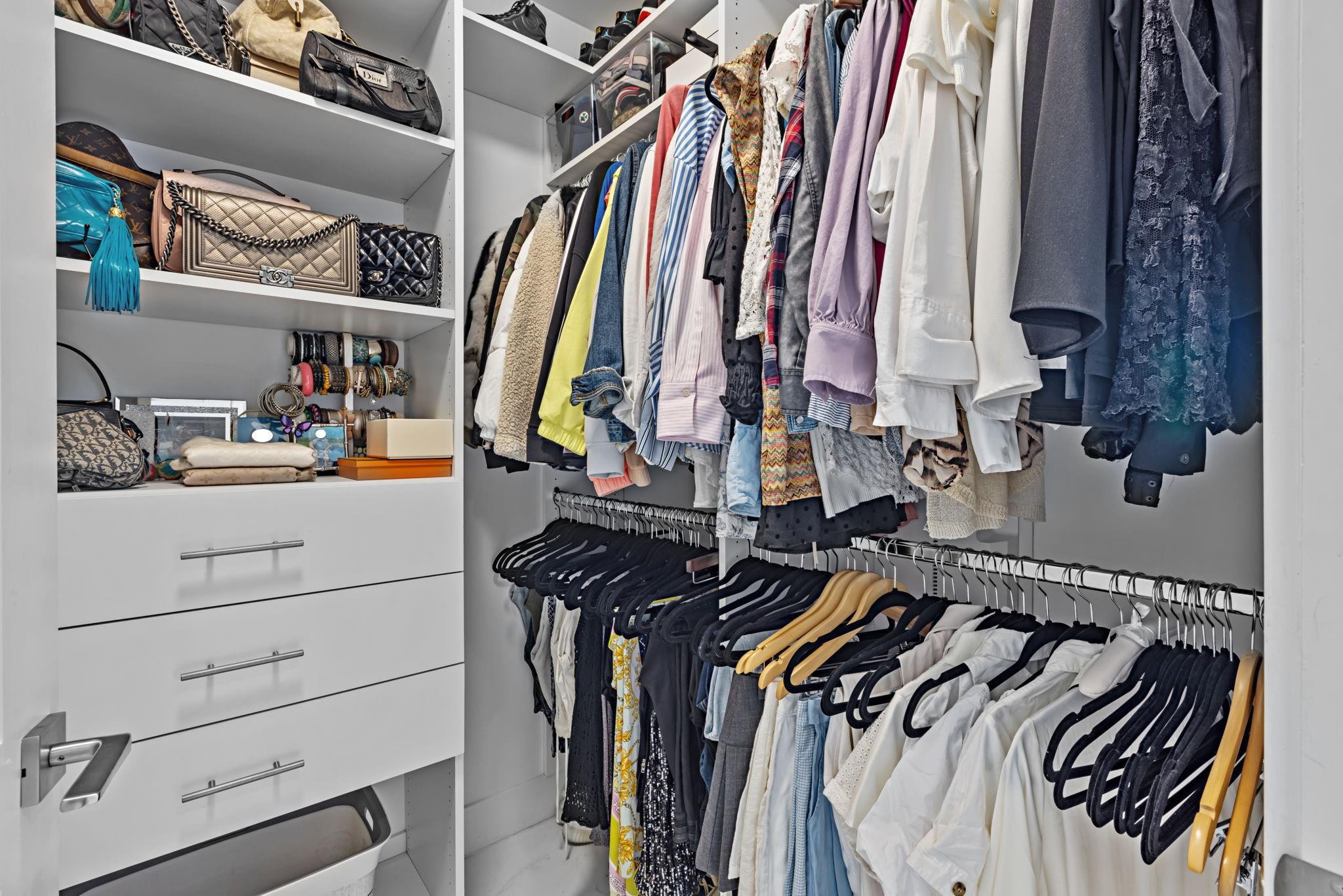 155 East Boca Raton Road, Unit 417 Boca Raton, FL 33432 - Photo 13 of 32 a view of walk in closet with clothes and shoes