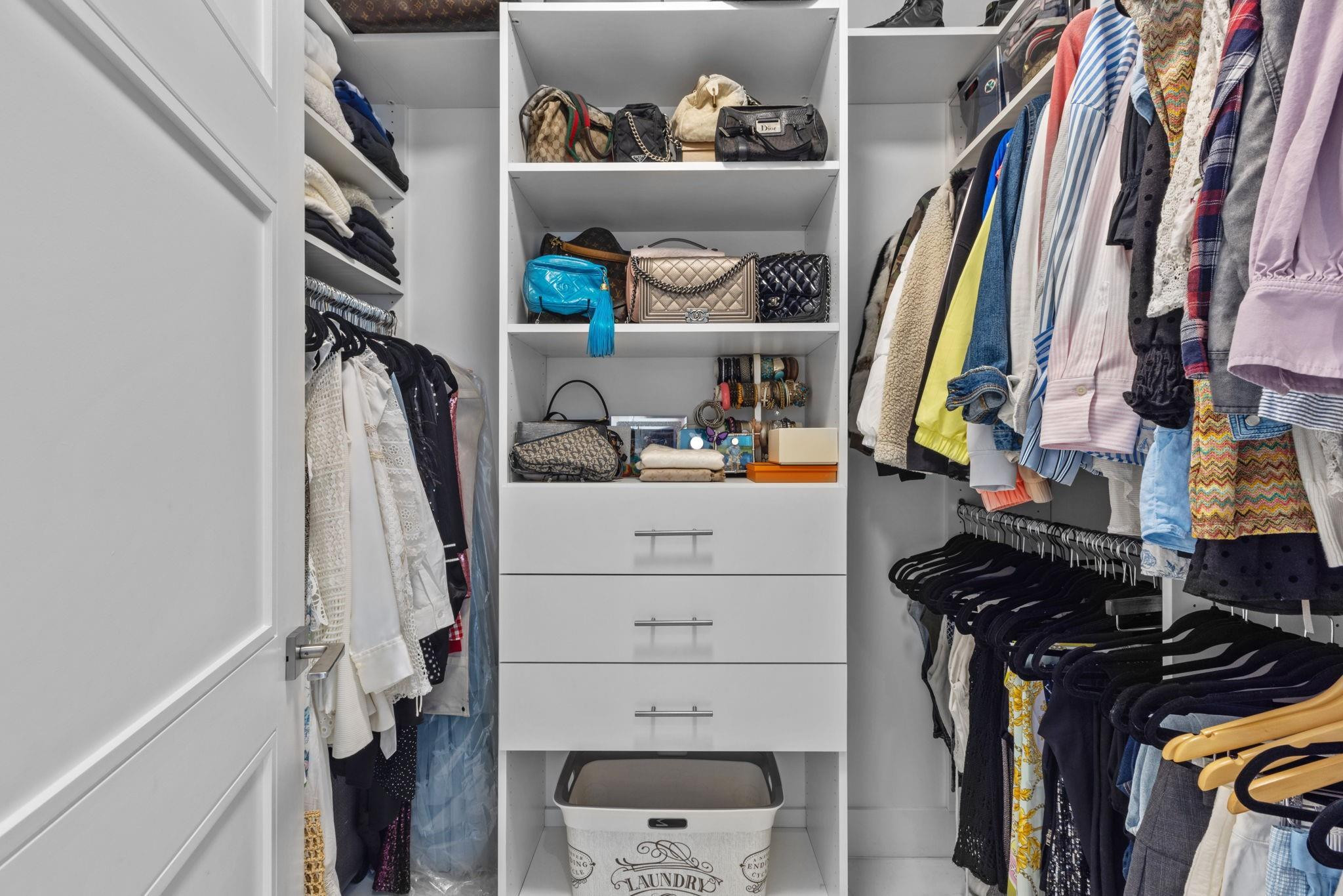 155 East Boca Raton Road, Unit 417 Boca Raton, FL 33432 - Photo 14 of 32 a view of walk in closet with clothes and shoes
