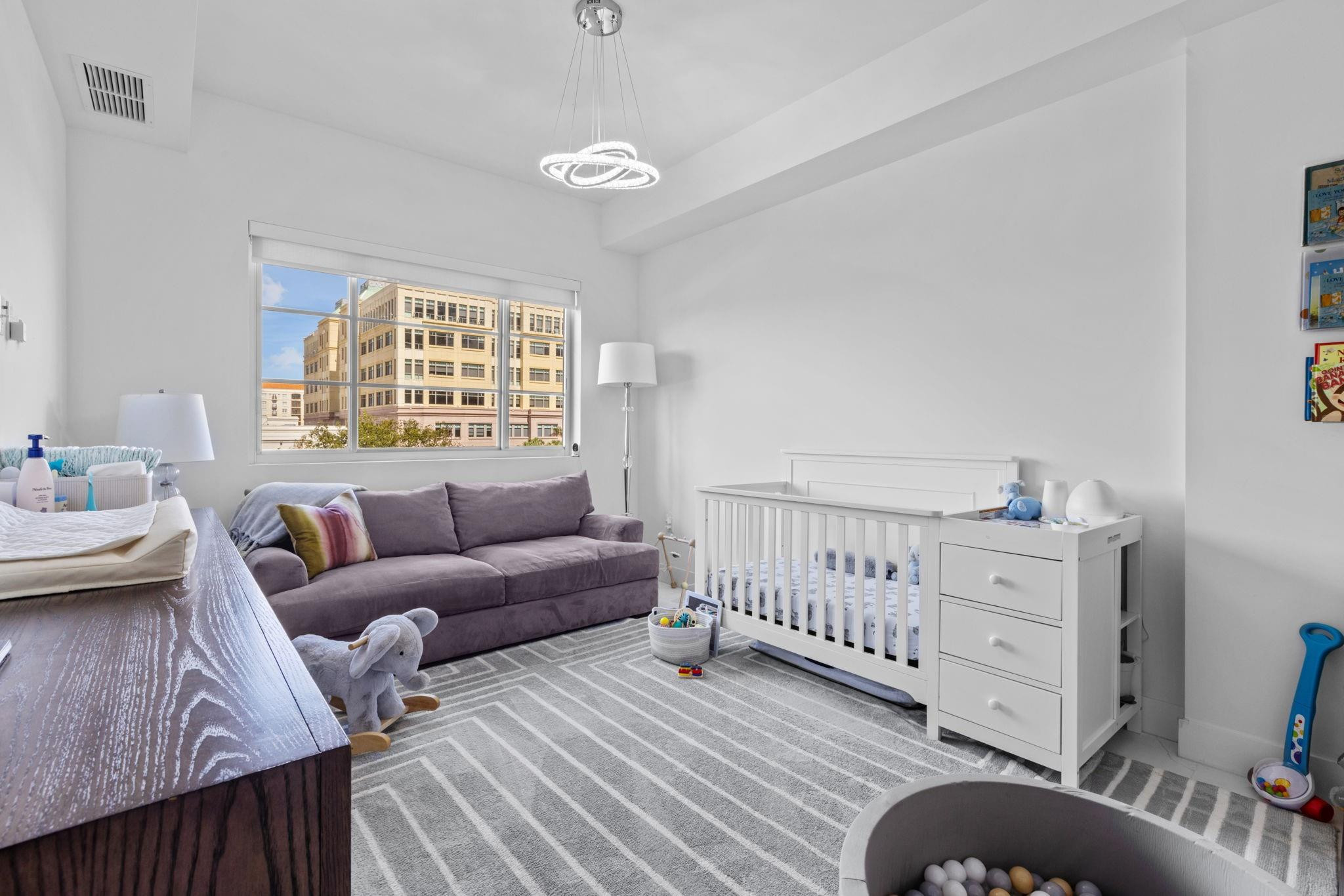 155 East Boca Raton Road, Unit 417 Boca Raton, FL 33432 - Photo 15 of 32 a bedroom with furniture and a window