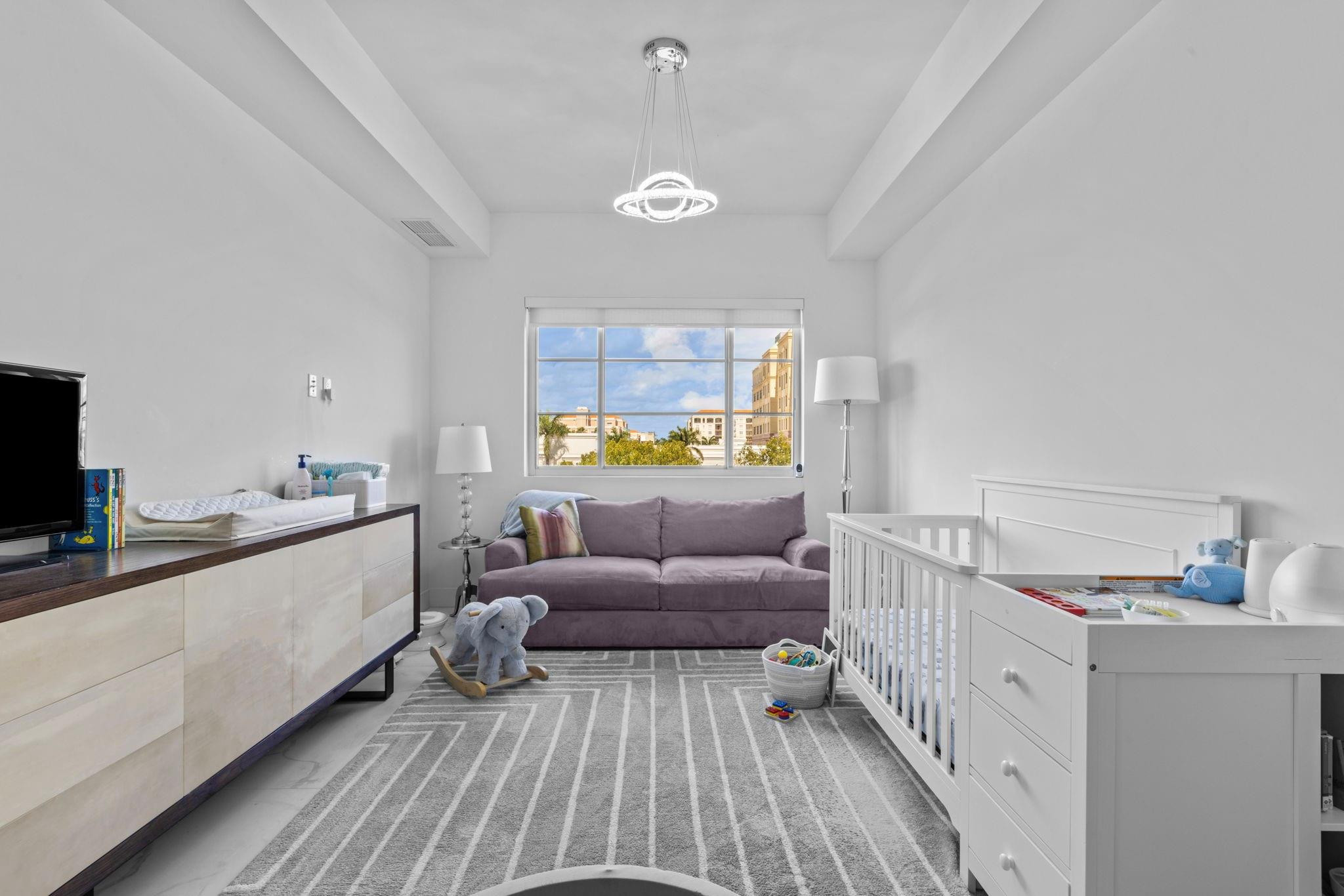 155 East Boca Raton Road, Unit 417 Boca Raton, FL 33432 - Photo 16 of 32 a living room with furniture and a wooden floor