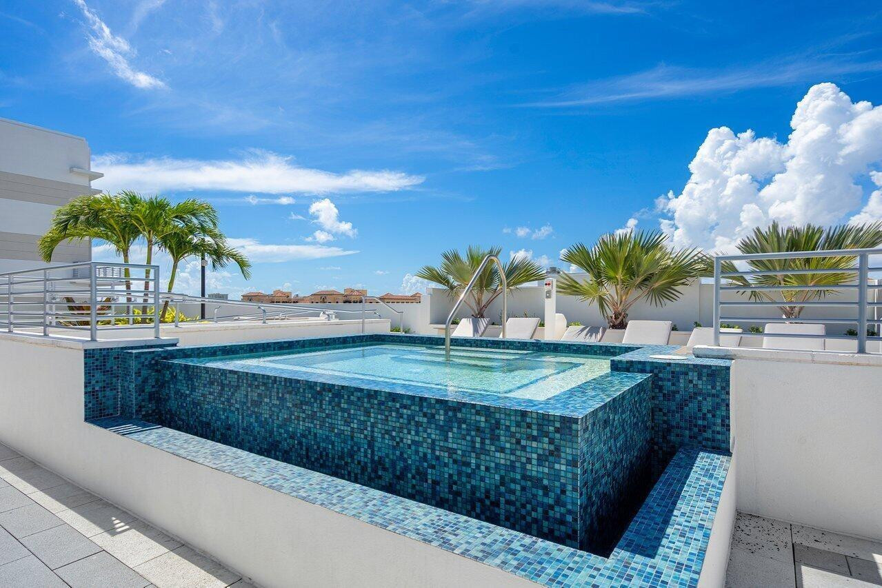 155 East Boca Raton Road, Unit 417 Boca Raton, FL 33432 - Photo 25 of 32 a view of a backyard and a swimming pool