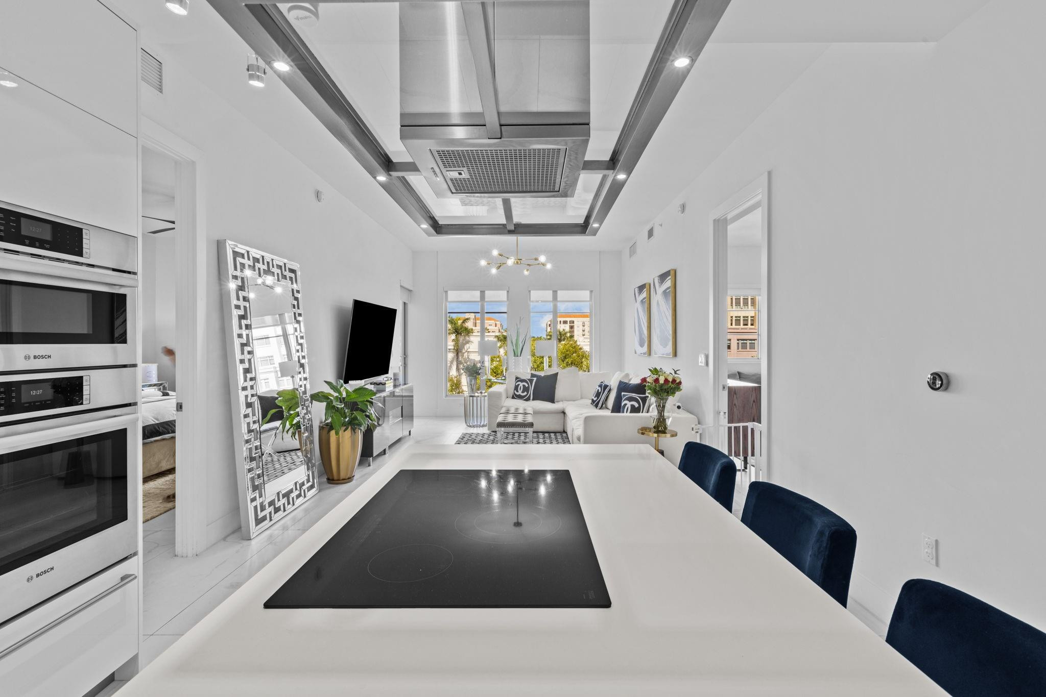 155 East Boca Raton Road, Unit 417 Boca Raton, FL 33432 - Photo 5 of 32 a view of a living room and kitchen with furniture