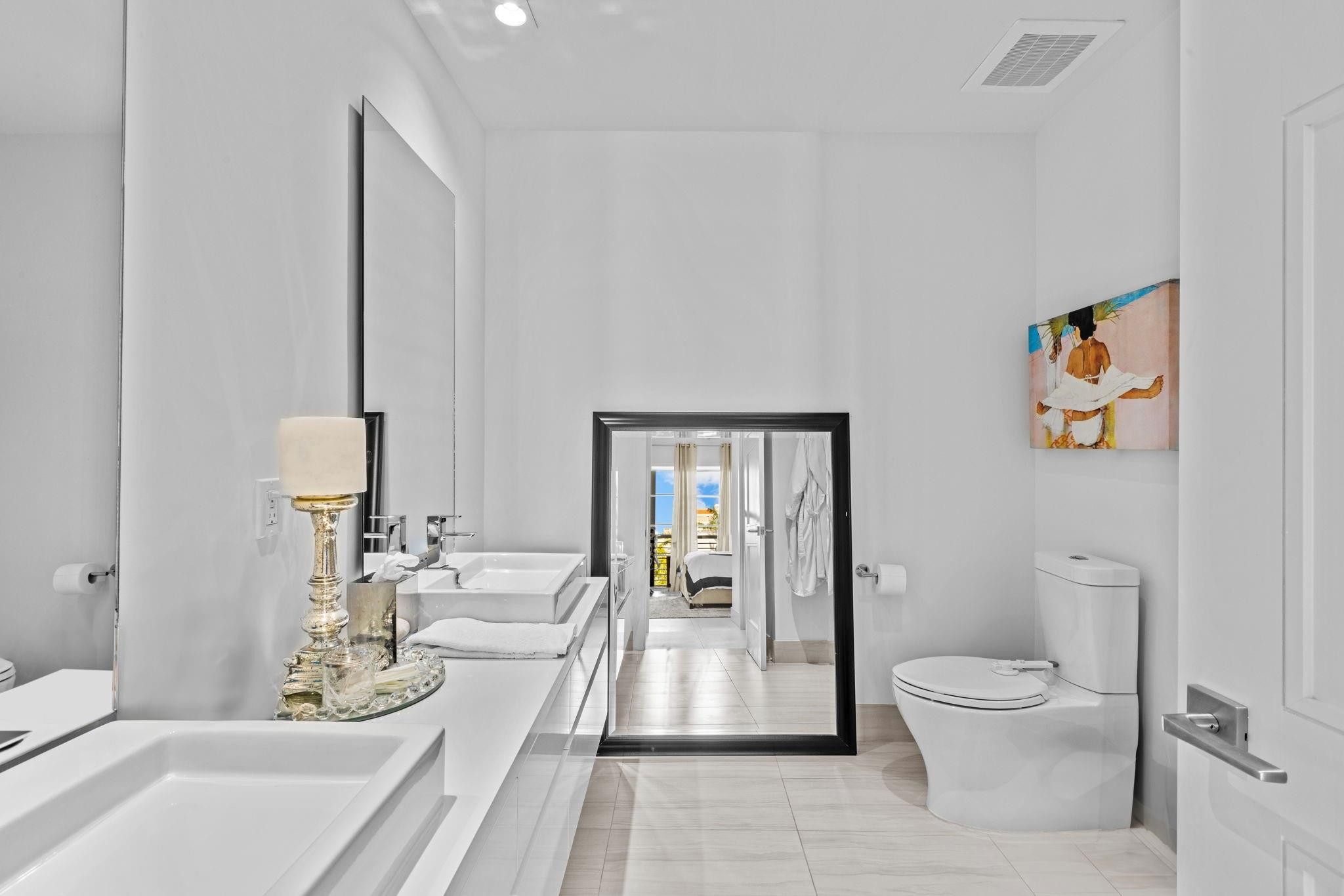 155 East Boca Raton Road, Unit 417 Boca Raton, FL 33432 - Photo 10 of 32 a living room with furniture and a toilet