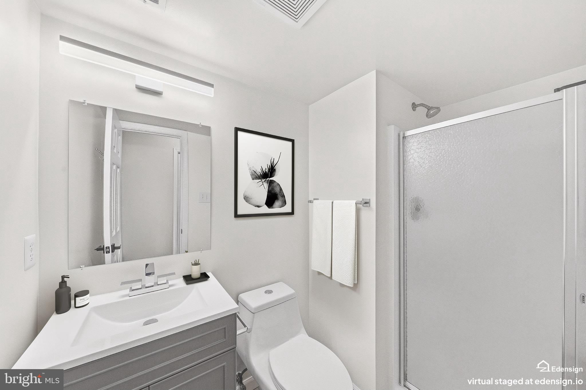 635 Waterloo Road, Unit 222 Warrenton, VA 20186 - Photo 20 of 28 a bathroom with a sink toilet and shower