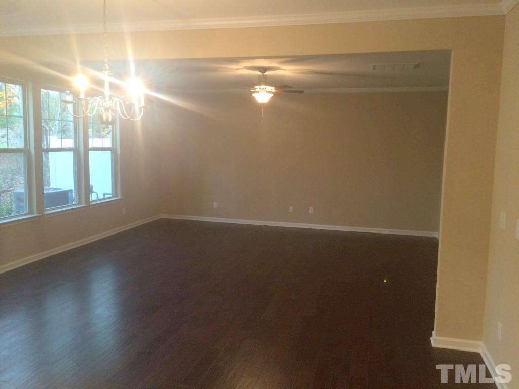3916 Cary, NC 27519 - Photo 6 of 16 a view of empty room with wooden floor and fan