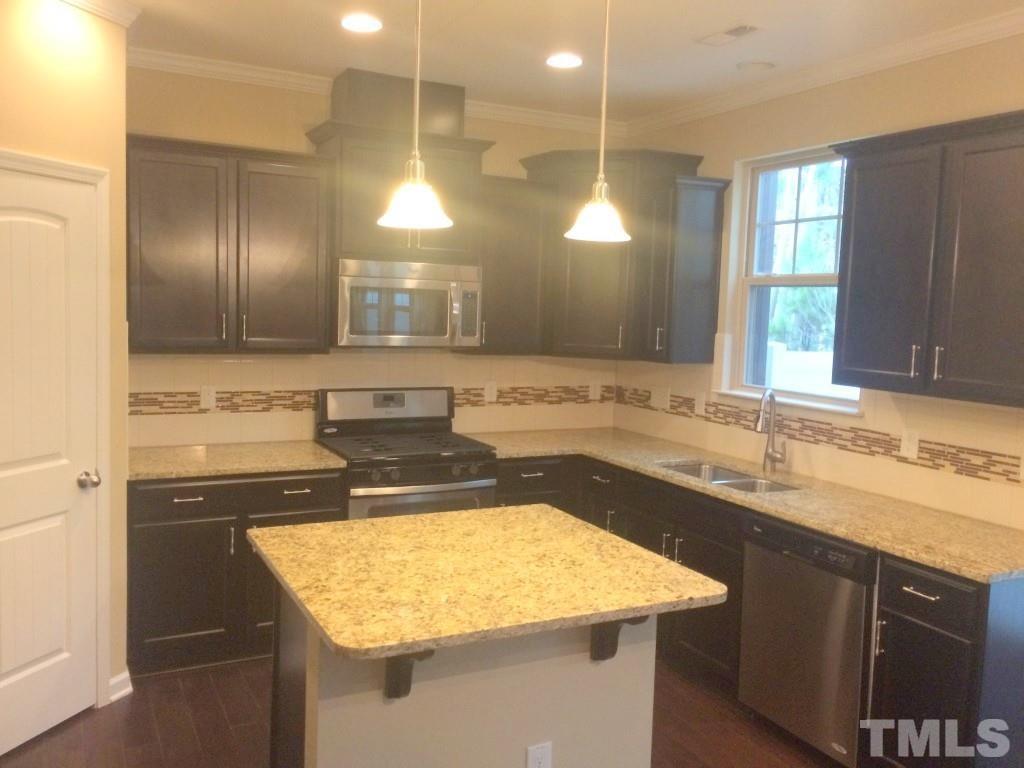 3916 Cary, NC 27519 - Photo 7 of 16 a bathroom with a sink and a mirror