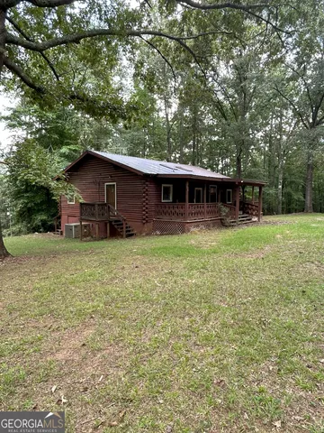 a backyard of a house with lots of green space