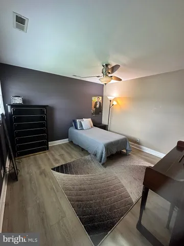 a bedroom with a bed and lamp