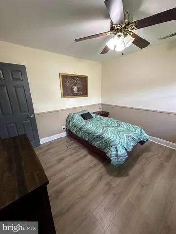 a bedroom with a bed and a dresser