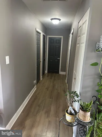 a living room with furniture and flowers