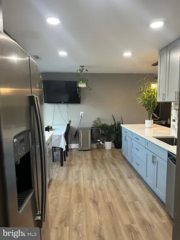a spacious bathroom with a double vanity sink and a mirror