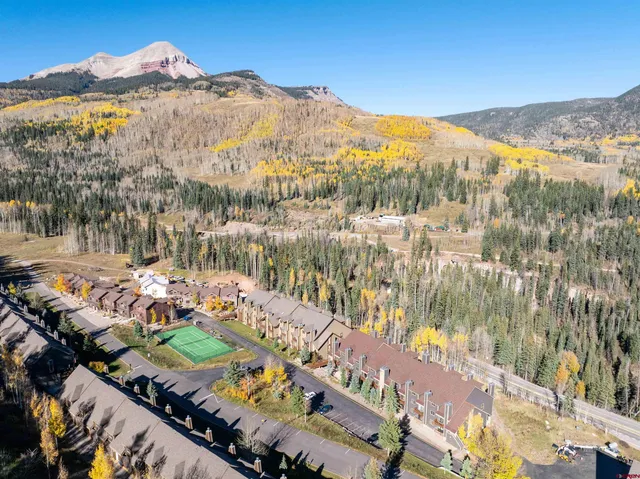 a view of a city with mountains in the background