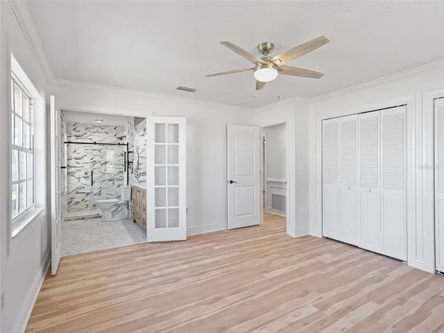 a bathroom with a toilet sink and shower