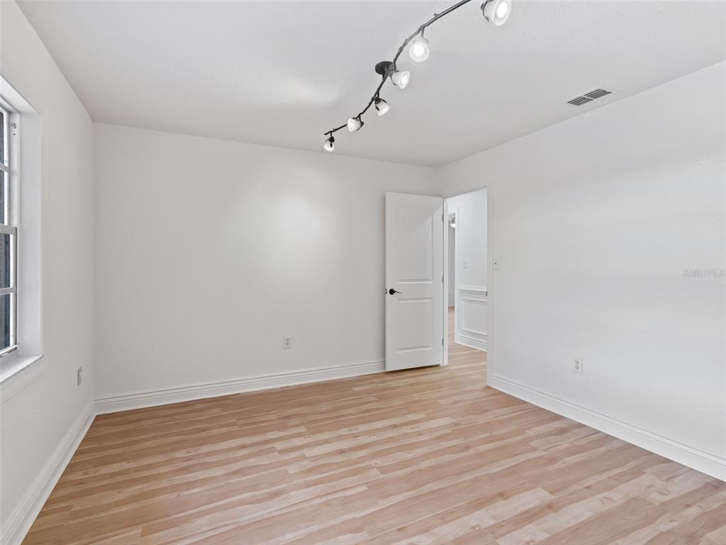10916 Southeast Timucuan Road Summerfield, FL 34491 - Photo 25 of 40 wooden floor in an empty room