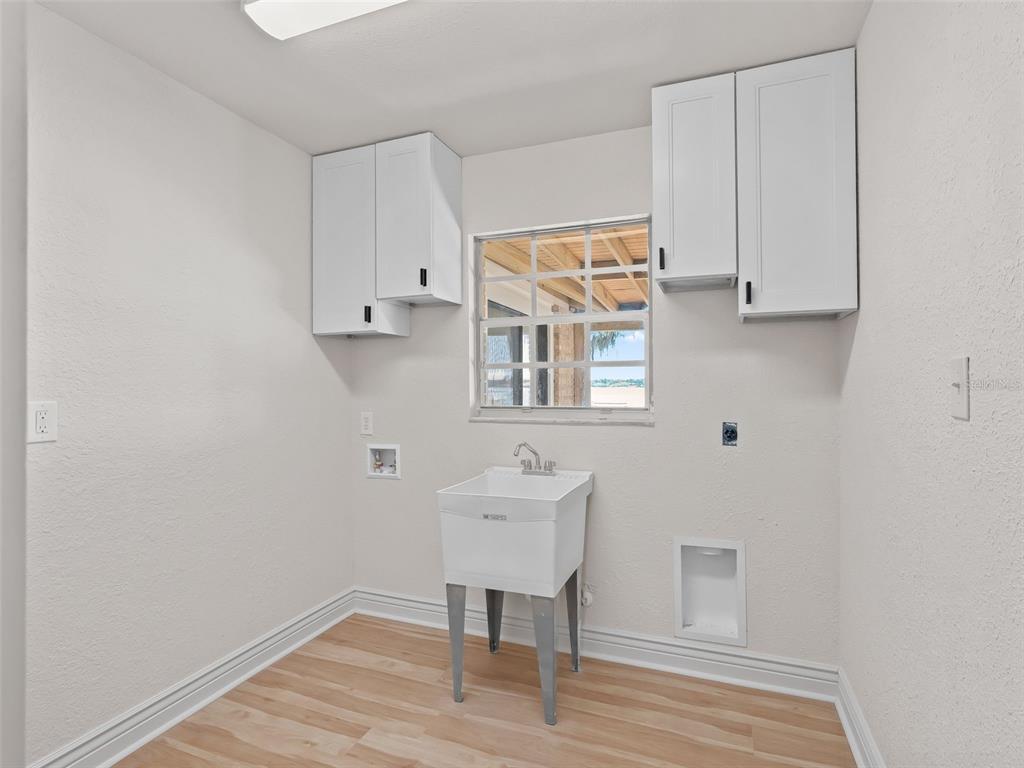 10916 Southeast Timucuan Road Summerfield, FL 34491 - Photo 28 of 40 a workspace room with wooden floor and windows