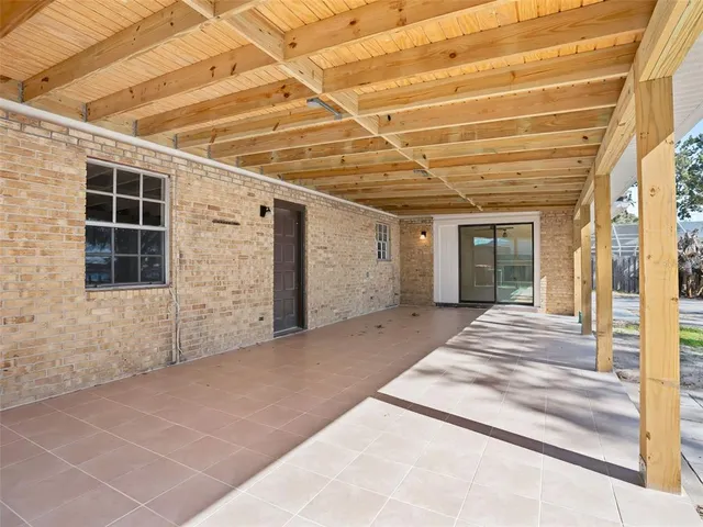 a view of a house with a backyard and porch
