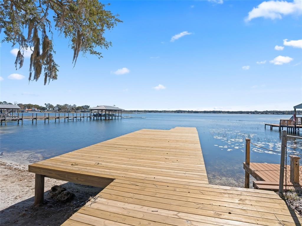 10916 Southeast Timucuan Road Summerfield, FL 34491 - Photo 34 of 40 a view of a lake and outdoor space