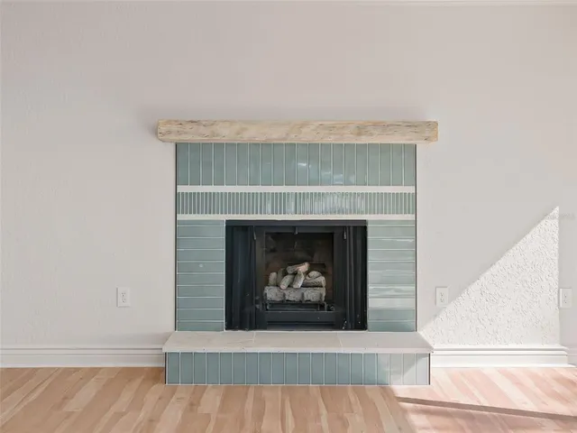 a large room with kitchen view and a window