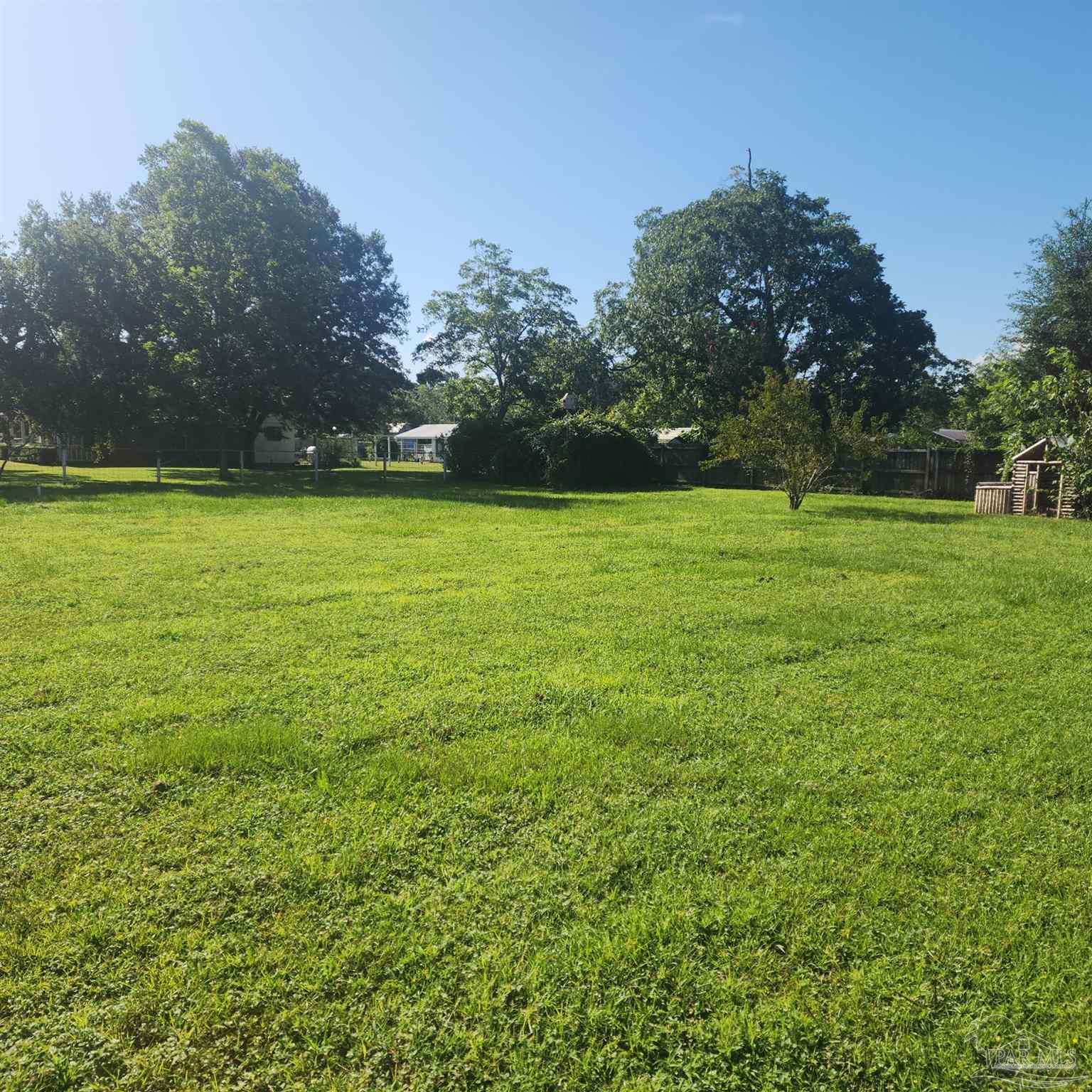 3217 Wallace Lake Road Pace, FL 32571 - Photo 17 of 17 a view of a field with trees