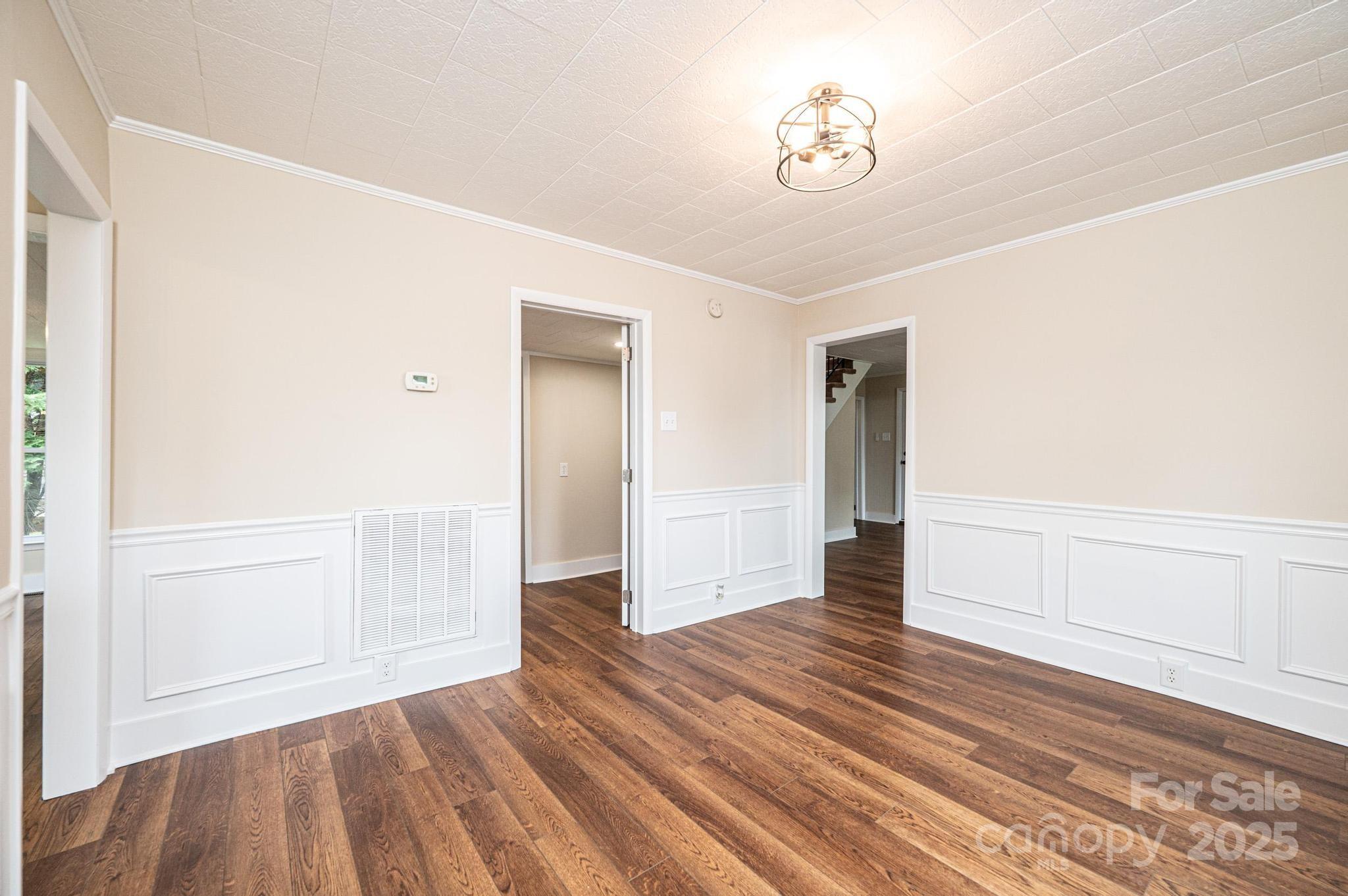 210 West 15th Street Newton, NC 28658 - Photo 13 of 43 a view of a hallway with wooden floor