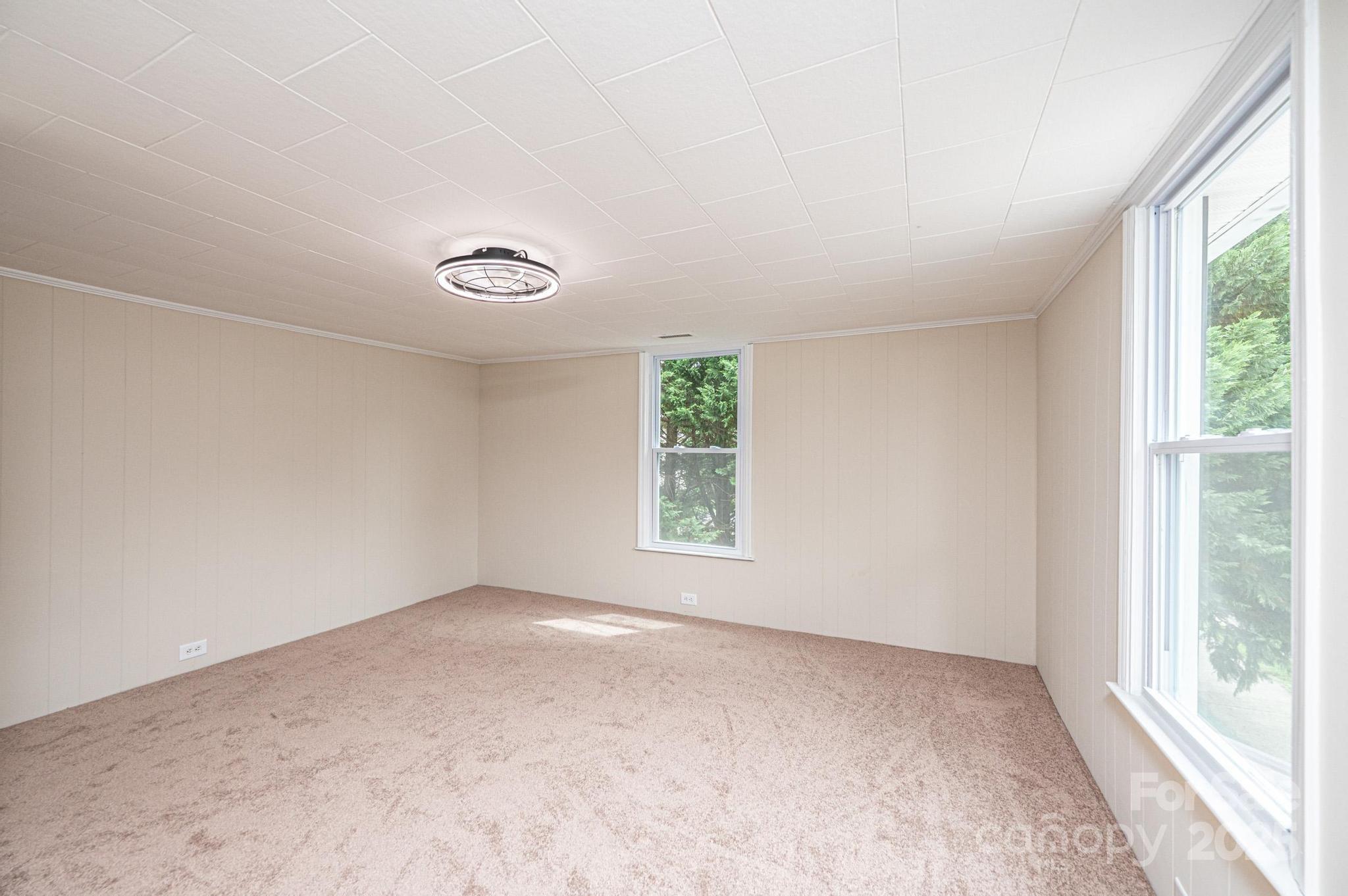 210 West 15th Street Newton, NC 28658 - Photo 32 of 43 an empty room with windows