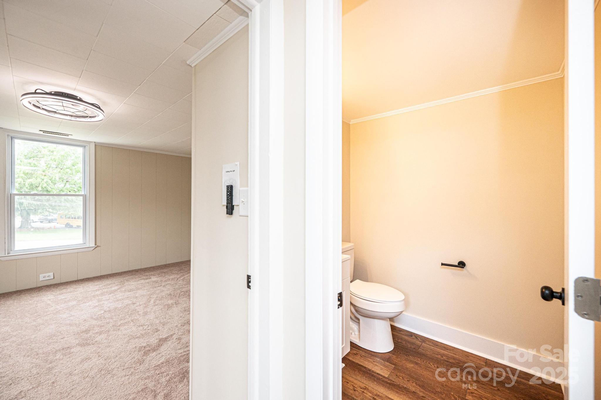 210 West 15th Street Newton, NC 28658 - Photo 35 of 43 a bathroom with a toilet and a shower