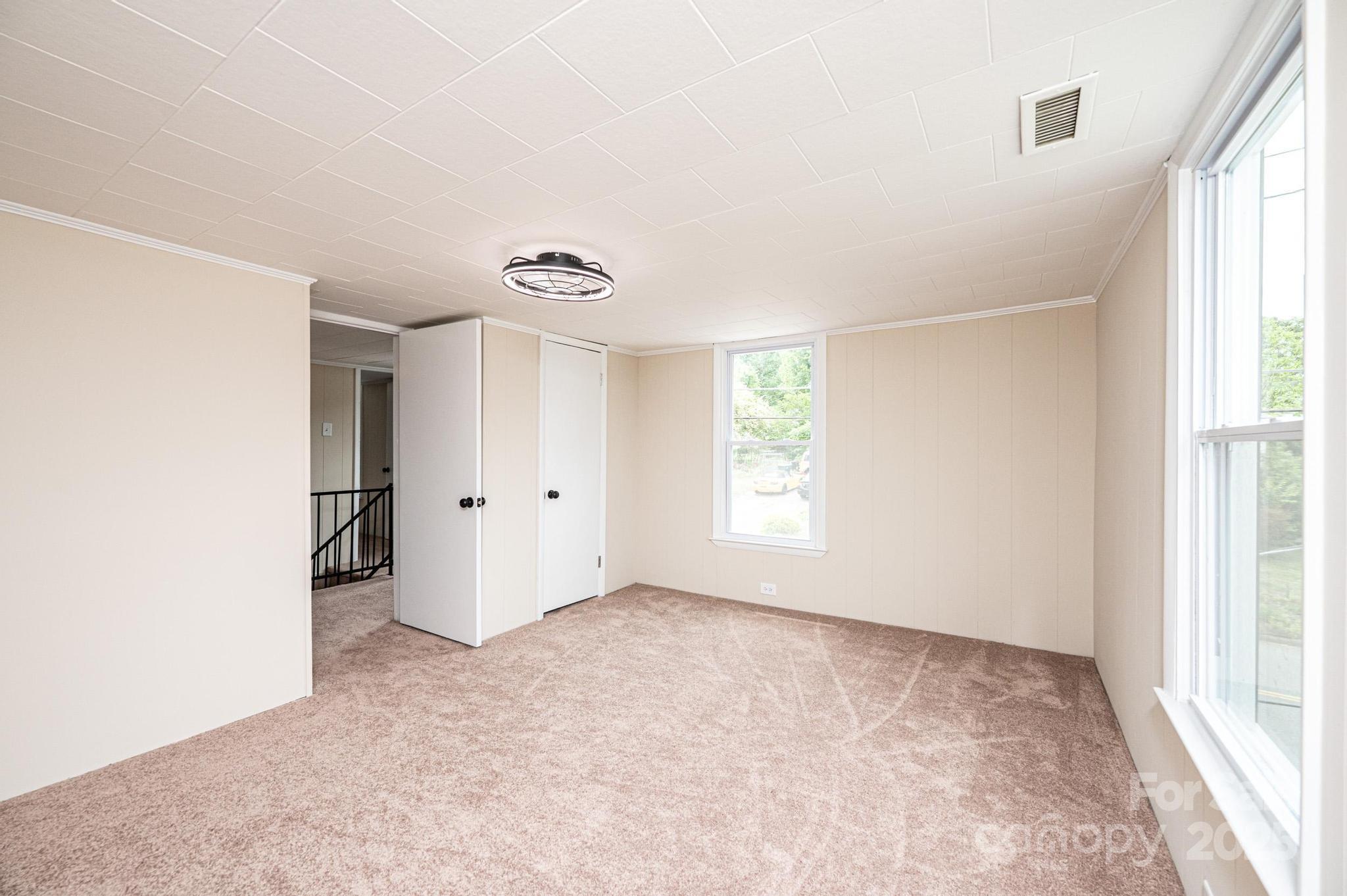 210 West 15th Street Newton, NC 28658 - Photo 40 of 43 a view of an empty room with a window