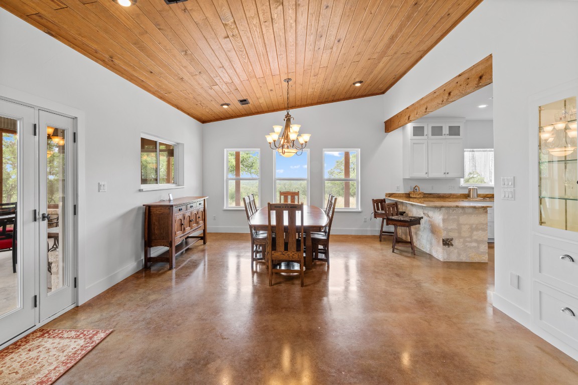 2321 Gentry Creek Road Menard, TX 76859 - Photo 12 of 35 a living room with furniture and a chandelier