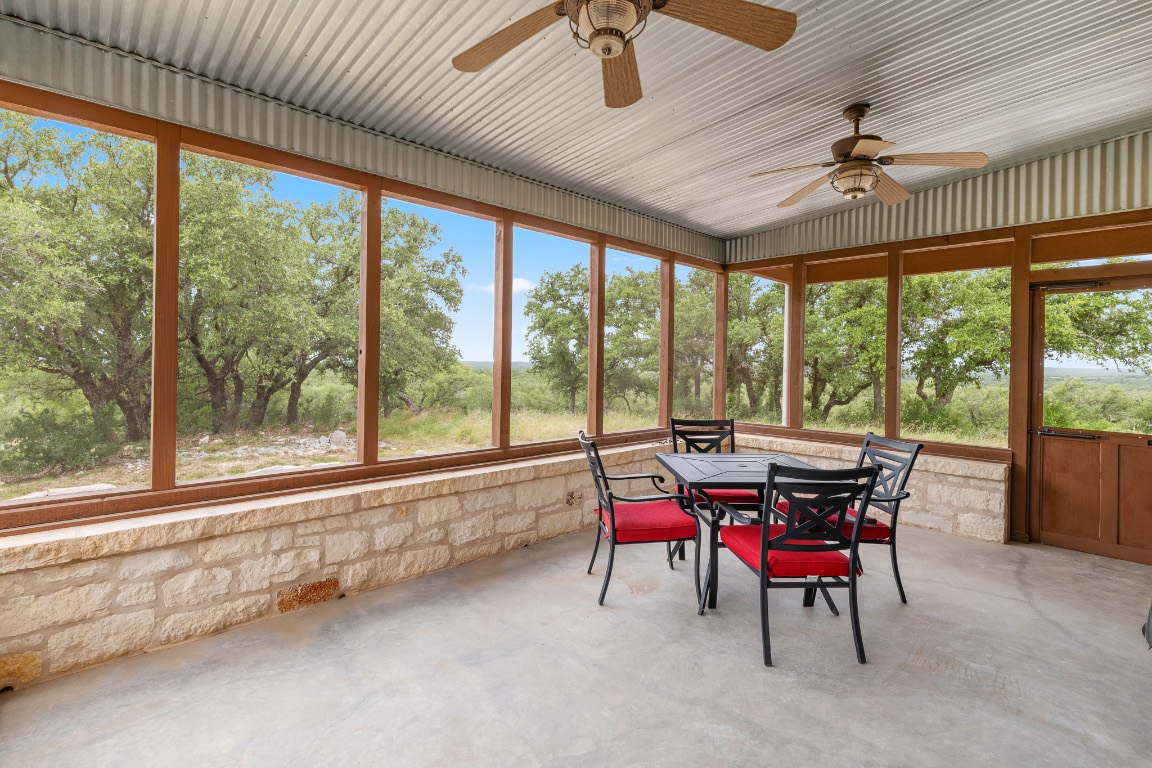 2321 Gentry Creek Road Menard, TX 76859 - Photo 18 of 35 a view of a dining room with furniture chandelier and a wooden floor