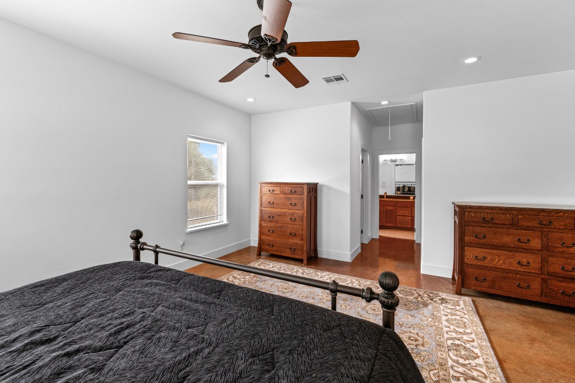 2321 Gentry Creek Road Menard, TX 76859 - Photo 20 of 35 a bedroom with a bed and a chair