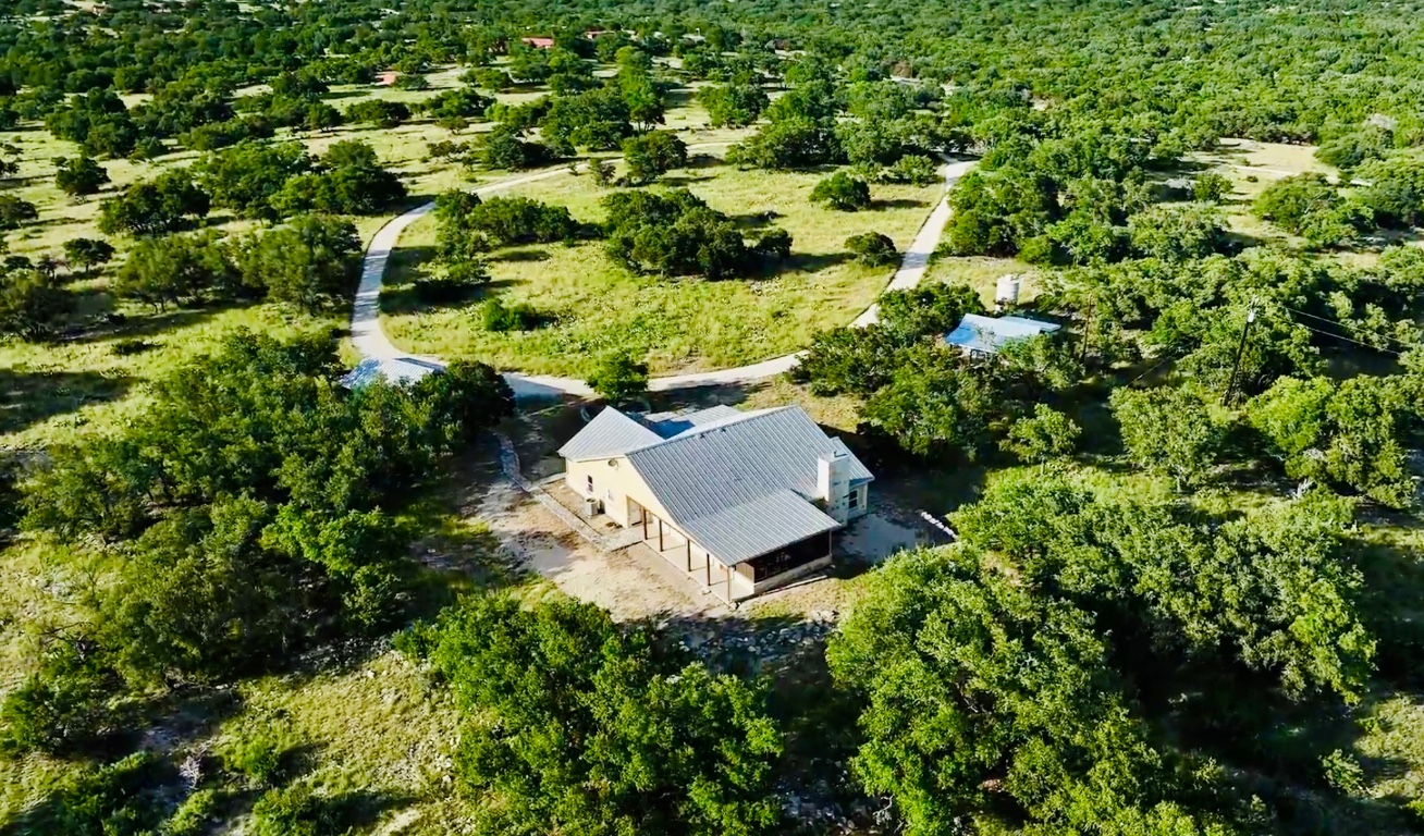 2321 Gentry Creek Road Menard, TX 76859 - Photo 2 of 35 an aerial view of residential house with outdoor space and trees all around