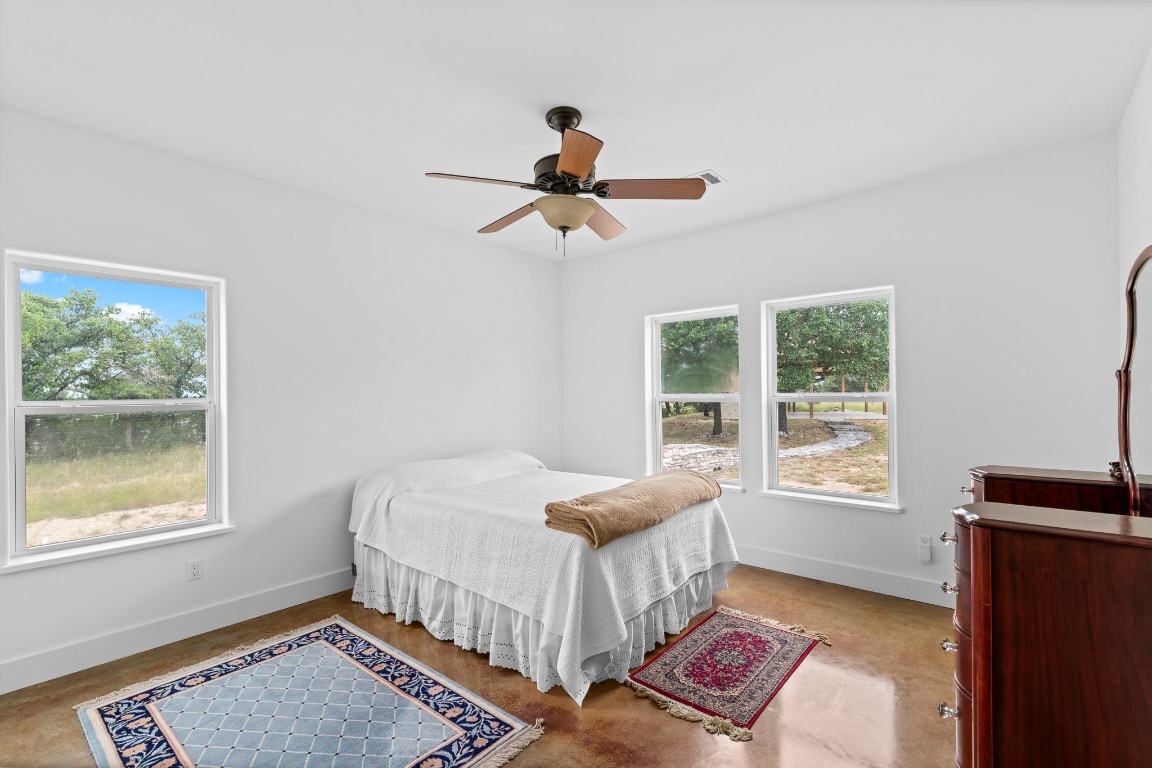 2321 Gentry Creek Road Menard, TX 76859 - Photo 24 of 35 a bedroom with a bed and a window