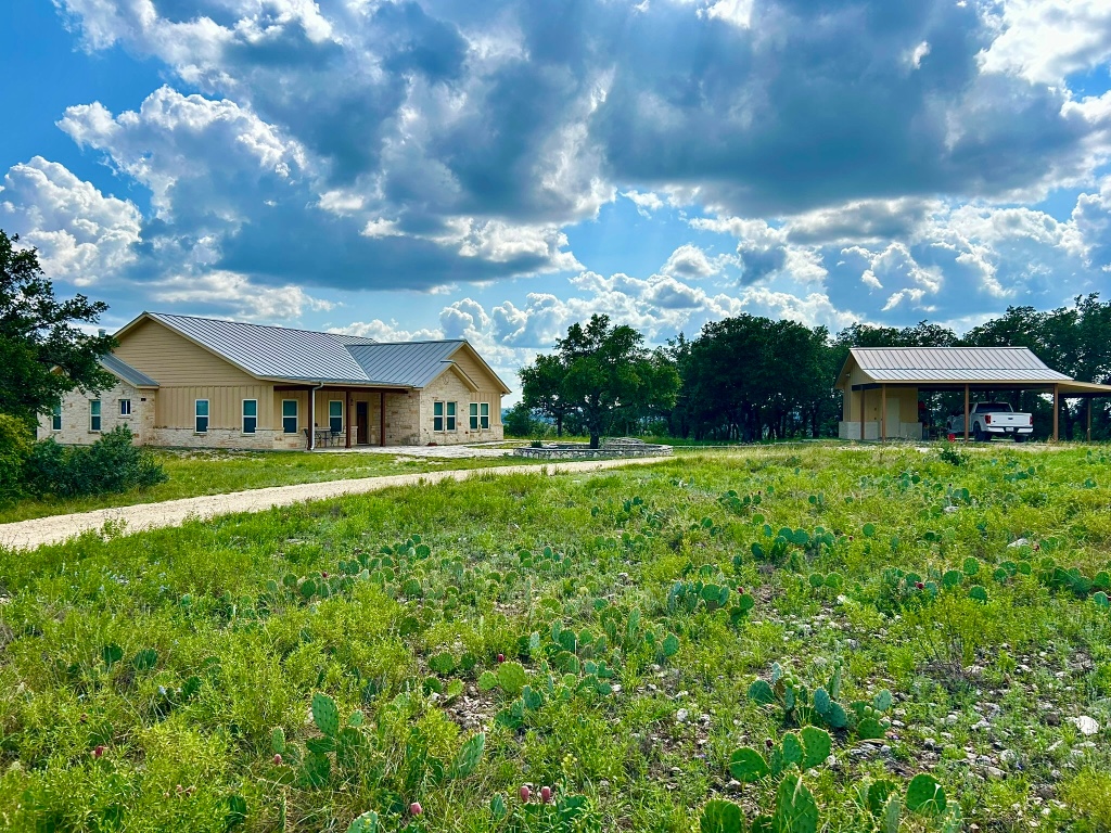 2321 Gentry Creek Road Menard, TX 76859 - Photo 5 of 35 a front view of house with yard and green space