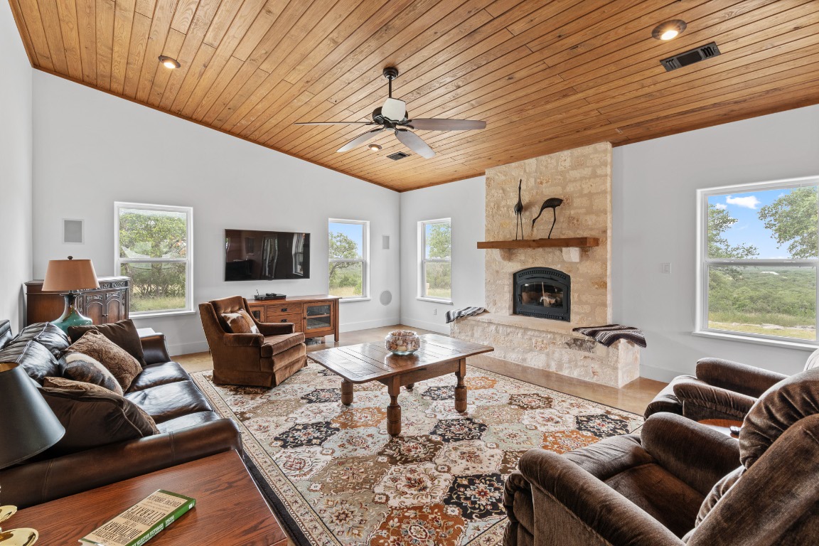 2321 Gentry Creek Road Menard, TX 76859 - Photo 9 of 35 a living room with furniture a flat screen tv and a fireplace