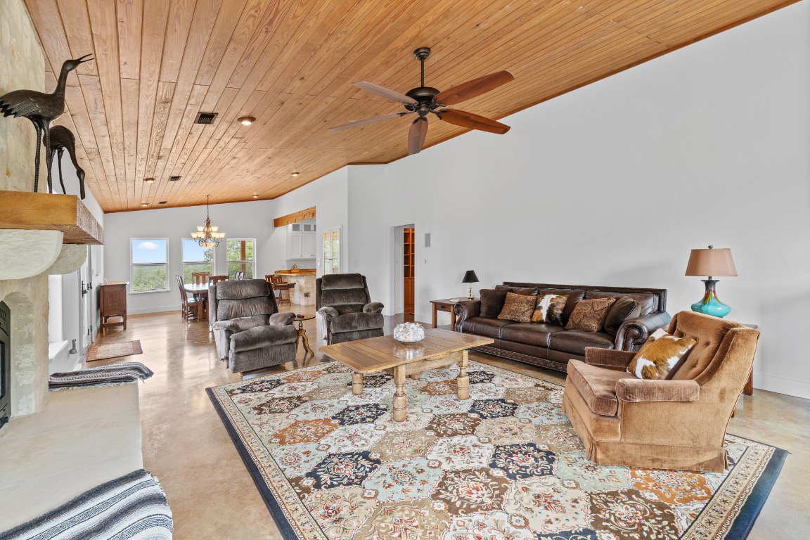 2321 Gentry Creek Road Menard, TX 76859 - Photo 10 of 35 a living room with furniture and a chandelier