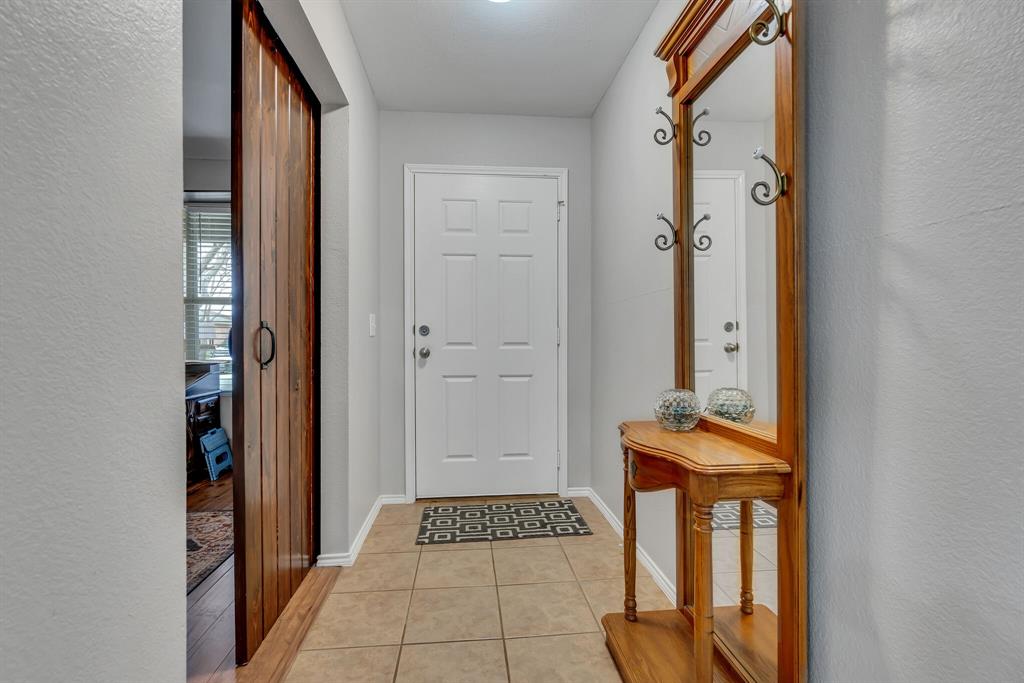 3616 Riesling Drive Denton, TX 76226 - Photo 2 of 18 Entryway featuring light tile patterned flooring and baseboards